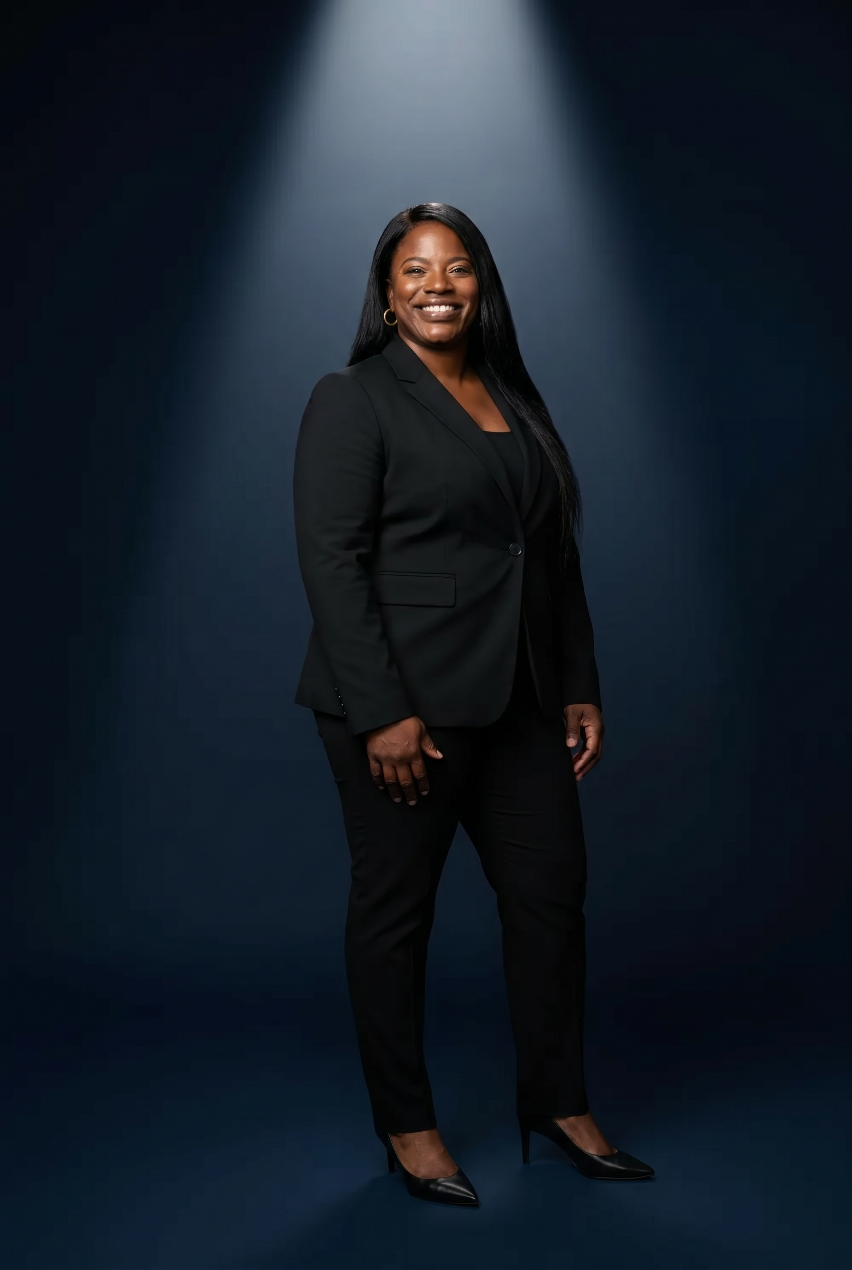 Dr. Pamela Buchanan in a sharp black power suit